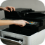 Engineer servicing an office printer